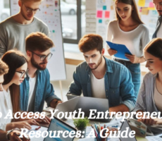 Group of young adults in a modern room with laptops and papers, discussing Entrepreneurship resources.